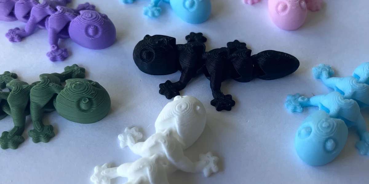 Colourful 3D-printed PLA fidget toys fresh from the printer